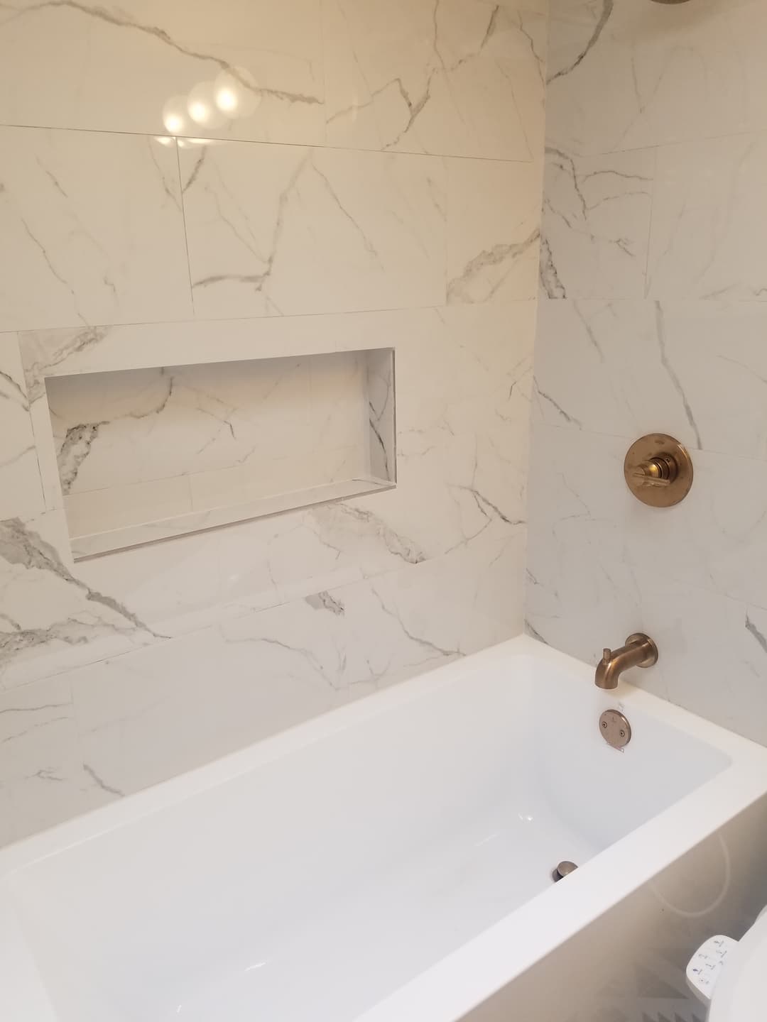 Remodeled bathroom bathtub and shower