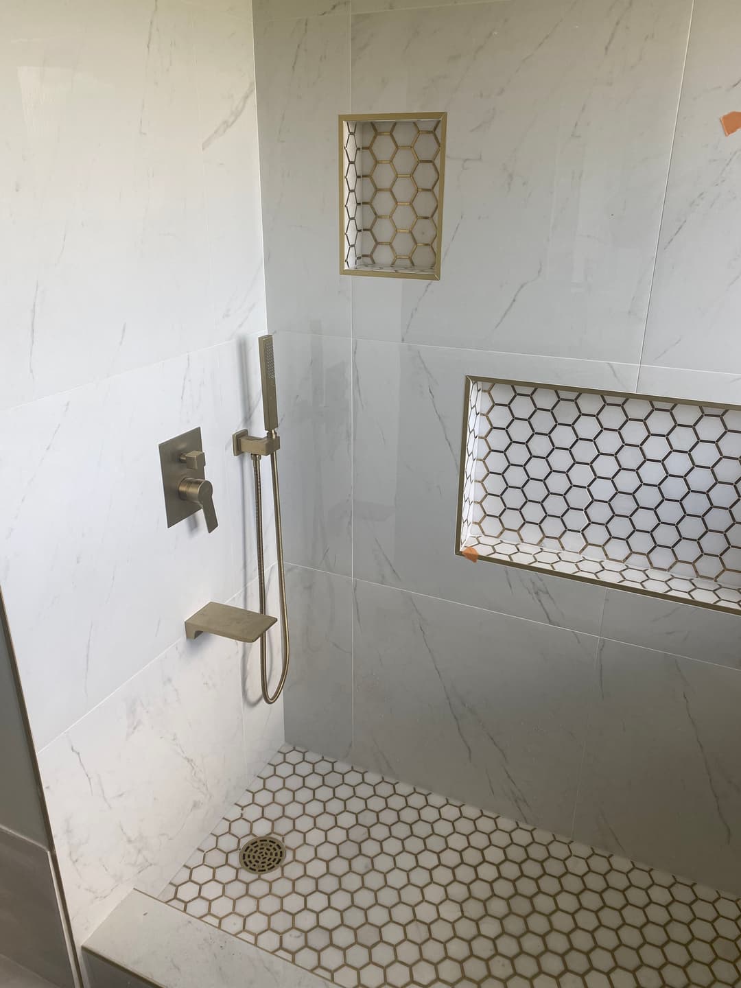 Remodeled bathroom shower with new tile